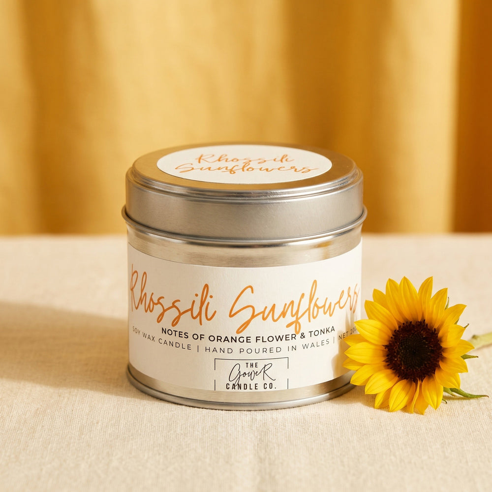 Rhossili Sunflowers soy candle in a brushed tin with notes of orange flower and tonka, hand-poured in Wales by The Gower Candle Co.