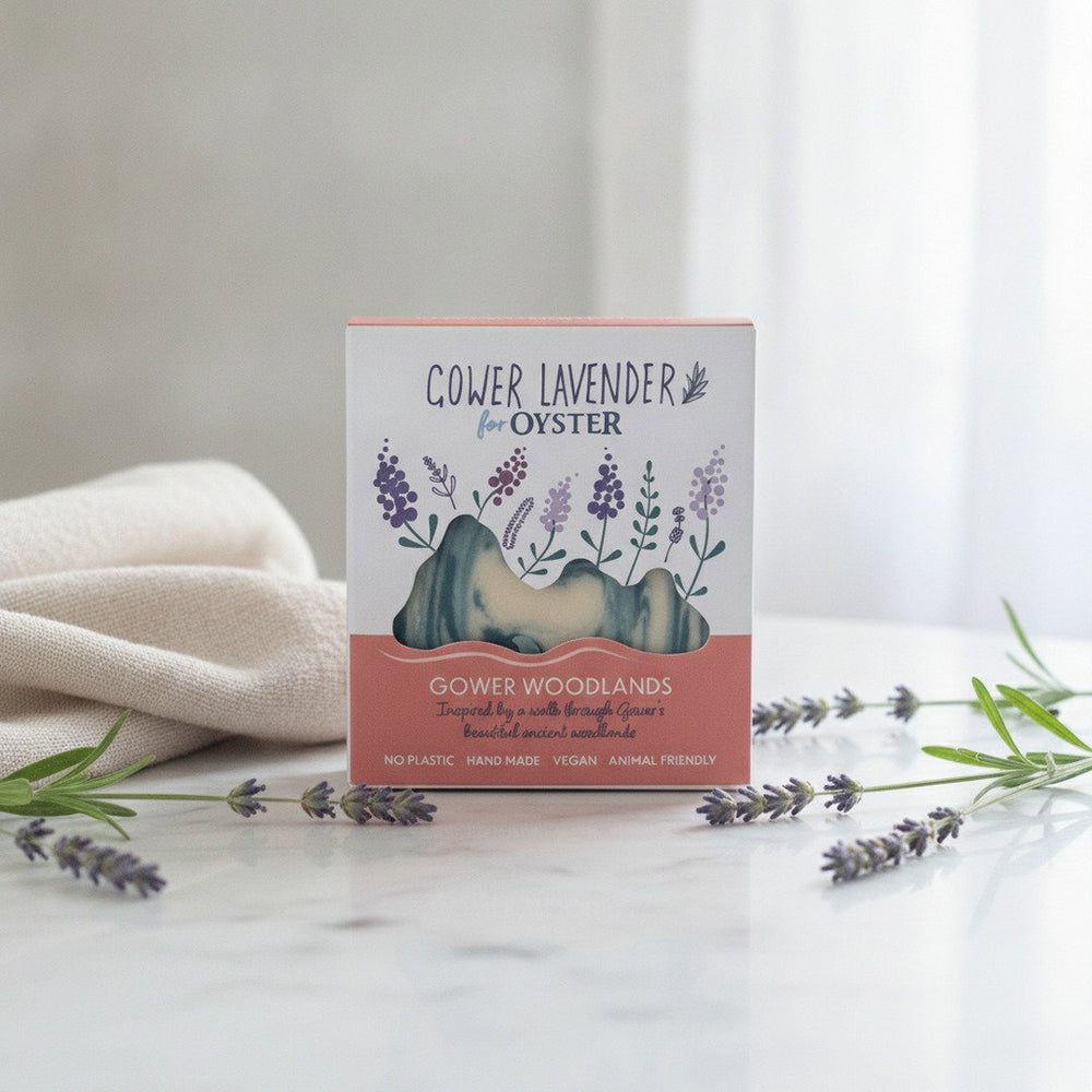 Gower Lavender Gower Woodlands handmade soap, boxed, on a white marble bathroom vanity with fresh lavender