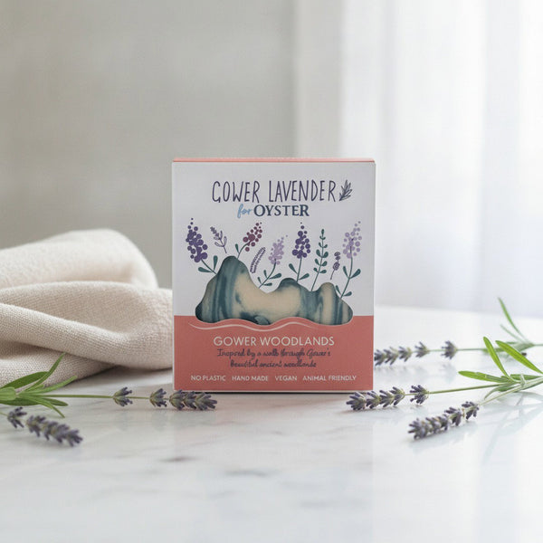Gower Lavender Gower Woodlands handmade soap, boxed, on a white marble bathroom vanity with fresh lavender