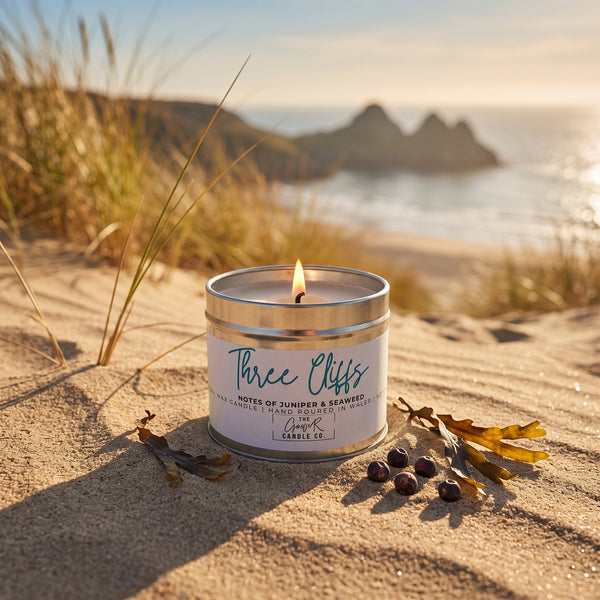 Three Cliffs soy candle in a brushed tin with notes of juniper and seaweed, hand-poured in Wales by The Gower Candle Co.