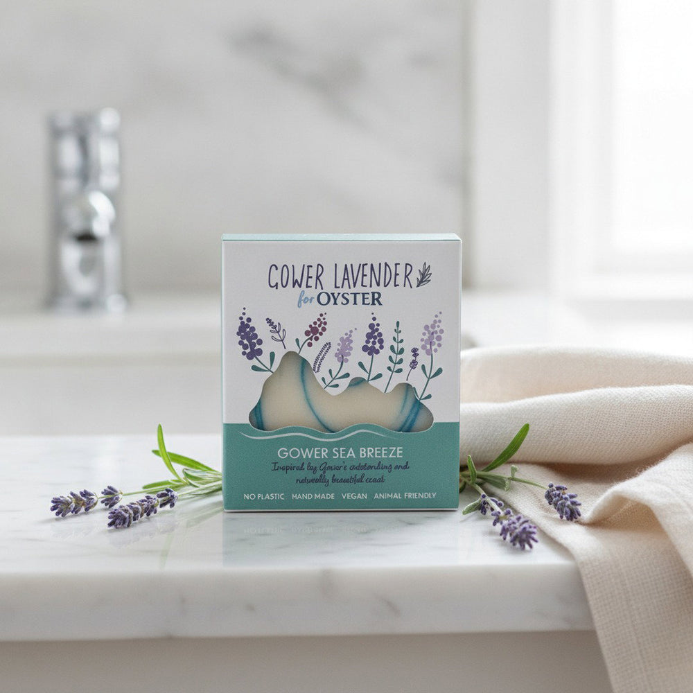Gower Lavender Gower Sea Breeze handmade soap, boxed, on a white marble bathroom vanity with fresh lavender