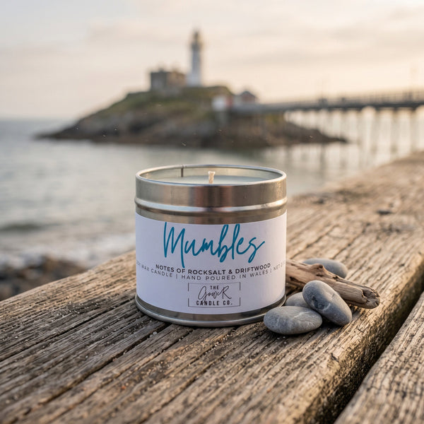 Mumbles soy candle in a brushed tin with notes of rocksalt and driftwood, hand-poured in Wales by The Gower Candle Co.