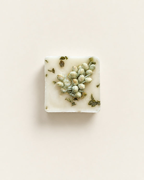 Blue Spruce and Mistletoe botanical soy wax melt topped with dried sage-green buds