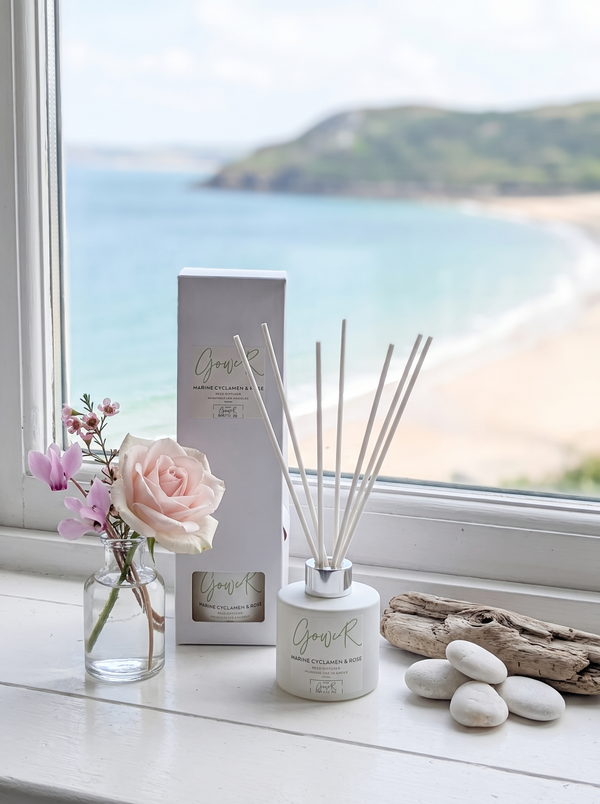 Gower reed diffuser with reed sticks, marine cyclamen and rose scent, by The Gower Candle Co.