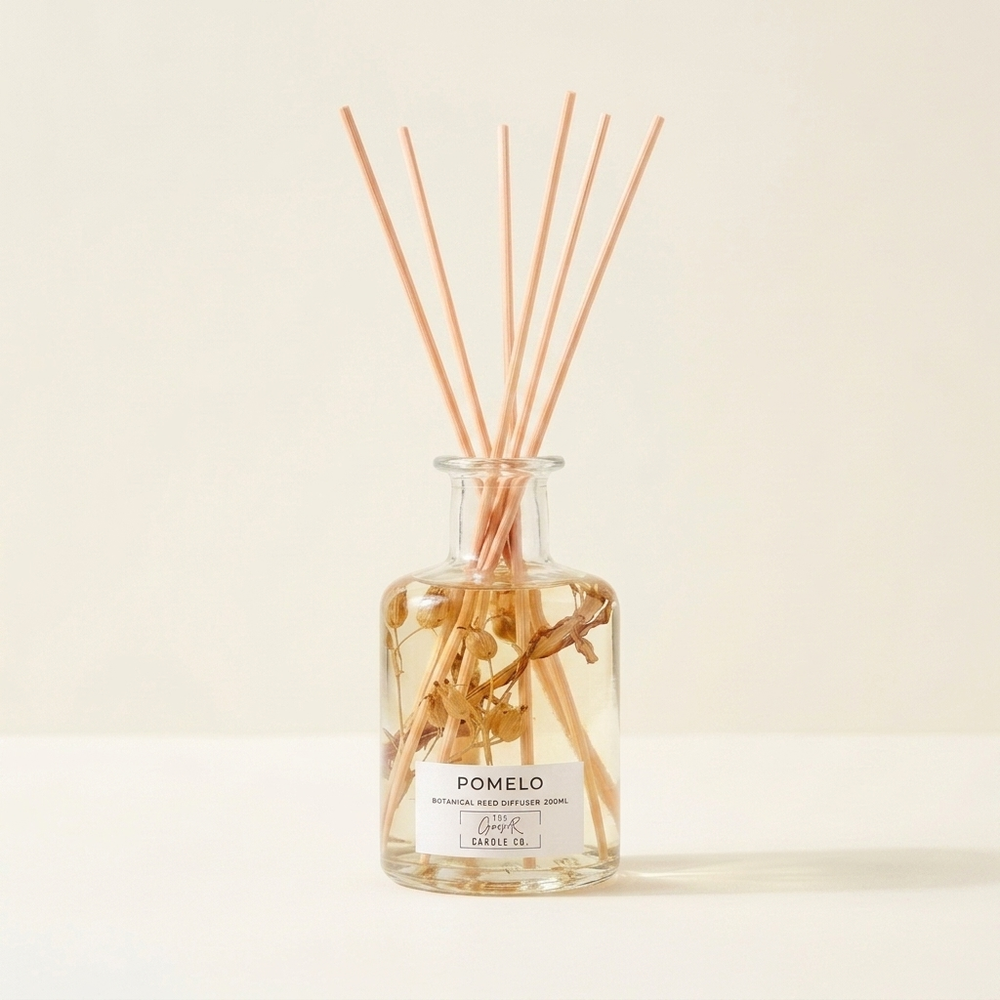 Pomelo Botanical Reed Diffuser 200ml by The Gower Candle Co. with dried sprigs