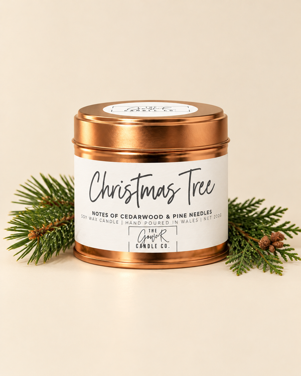 Christmas Tree rose gold soy candle by The Gower Candle Co. with pine and cedar sprigs