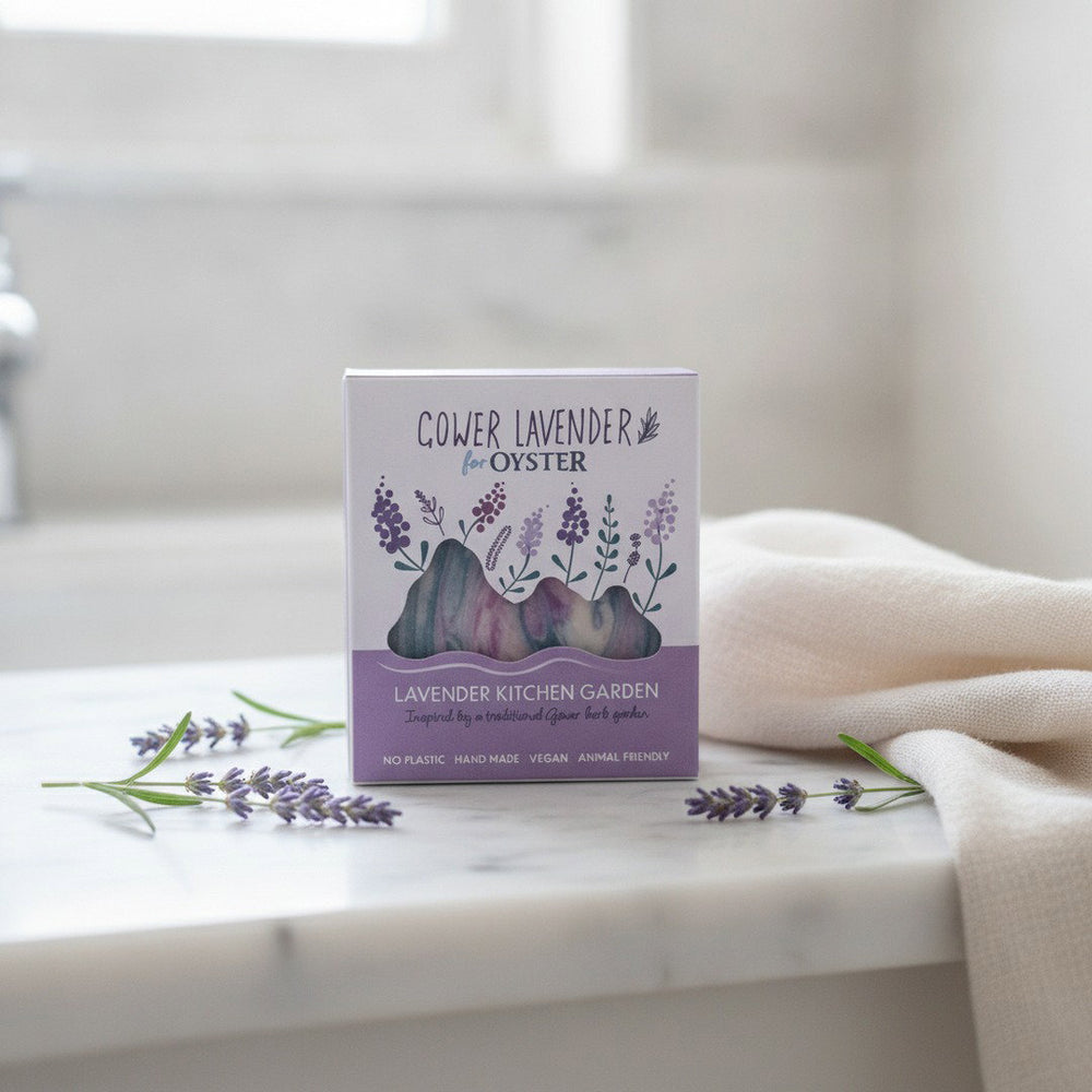 Gower Lavender Lavender Kitchen Garden handmade soap, boxed, on a white marble bathroom vanity with fresh lavender
