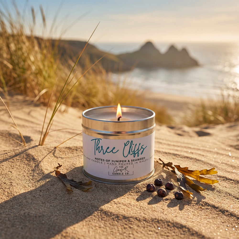 Three Cliffs soy candle in a brushed tin with notes of juniper and seaweed, hand-poured in Wales by The Gower Candle Co.
