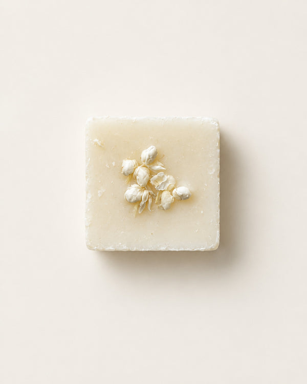 Snowfall botanical soy wax melt topped with dried white flower buds