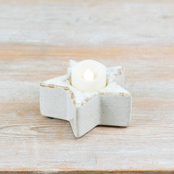 Ceramic star tealight holder in a speckled neutral glaze