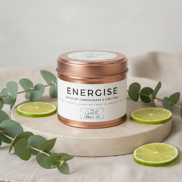 Energise Rose Gold Soy Candle by The Gower Candle Co. with fresh eucalyptus and sliced citrus