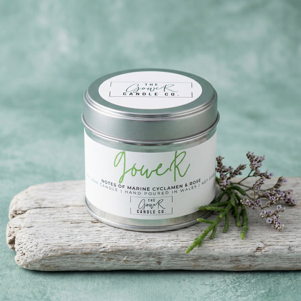Gower soy candle in a brushed tin with notes of marine cyclamen and rose, hand-poured in Wales by The Gower Candle Co.