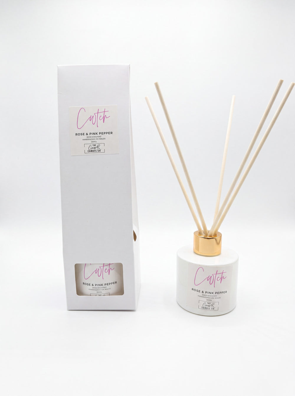 Cwtch rose and pink pepper reed diffuser with gold collar and gift box on white background, handpoured in Wales by The Gower Candle Co.