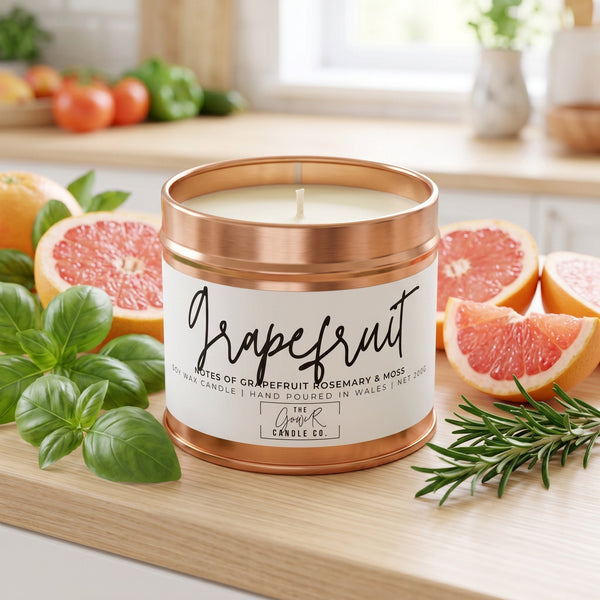 Grapefruit soy candle in a reusable tin, pink grapefruit and citrus zest scent, by The Gower Candle Co.