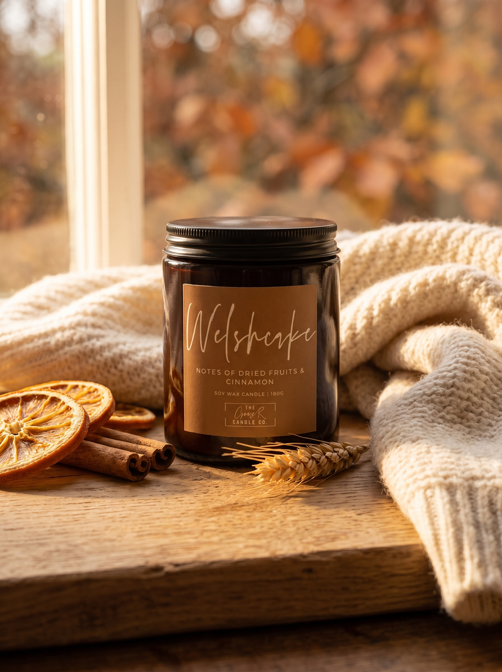 Welshcake candle styled in a cosy autumn window scene
