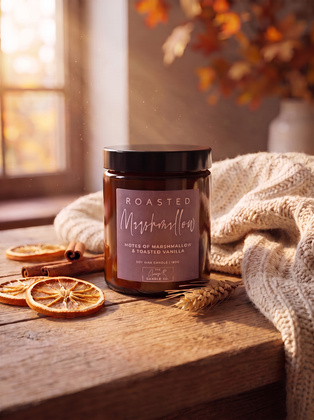 Roasted Marshmallow candle styled in a cosy autumn window scene