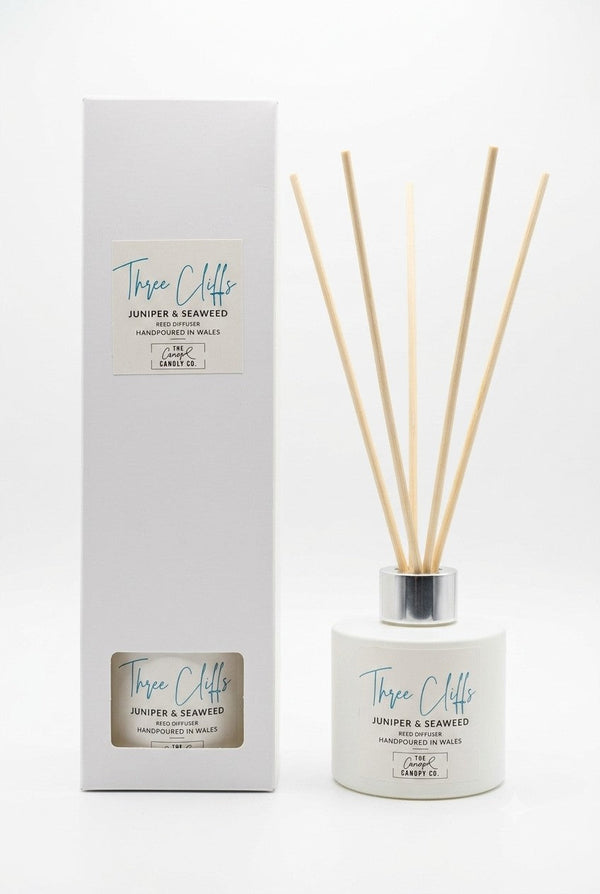 Three Cliffs juniper and seaweed reed diffuser with gift box on white background, handpoured in Wales by The Gower Candle Co.