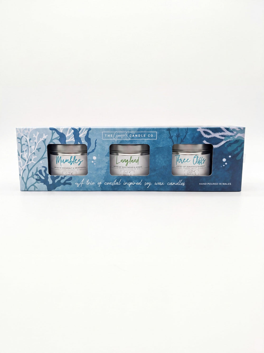 Coastal candle trio gift set with Mumbles, Langland and Three Cliffs soy wax tin candles in a blue gift box, handpoured in Wales by The Gower Candle Co.